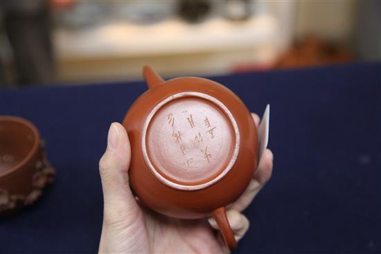 A Chinese Yixing pottery globular teapot and a similar prunus cup, 19th century, 6.5cm